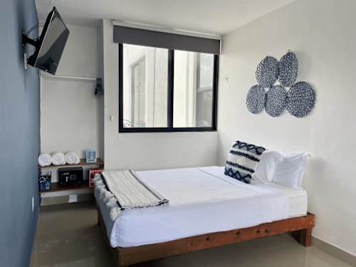 Studio living/sleeping area with double bed and sofa bed