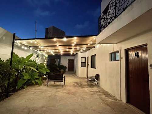 Garden courtyard and building exterior at dusk