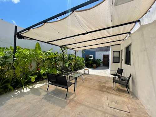 Shaded common terrace with seating (shared area)