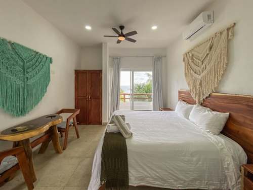 Private balcony with ocean-view daybed