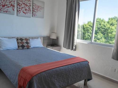 Bedroom with double bed and balcony