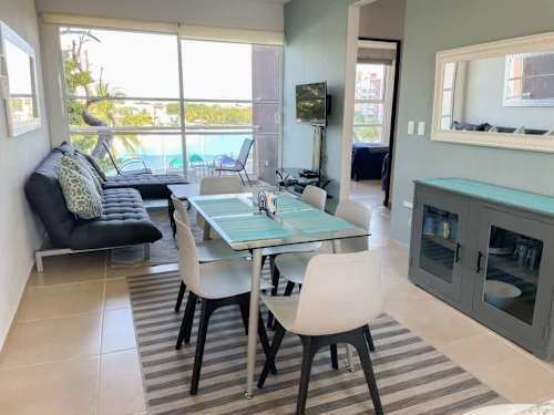 Living and dining area with lagoon views