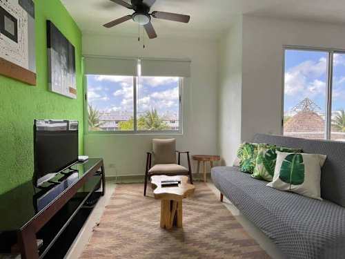 Living room with smart TV and comfy seating