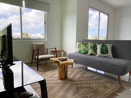 Living room with sofa and balcony access