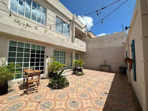 Shared building courtyard and walkway (evening).