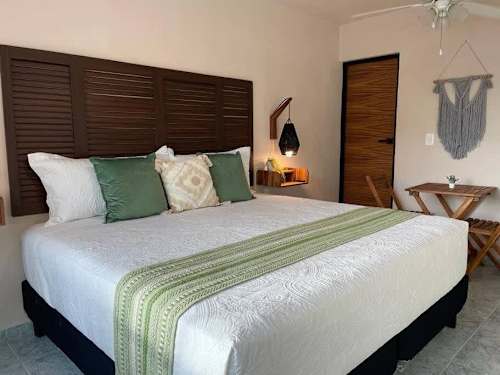 Studio sleeping area with king-size bed.