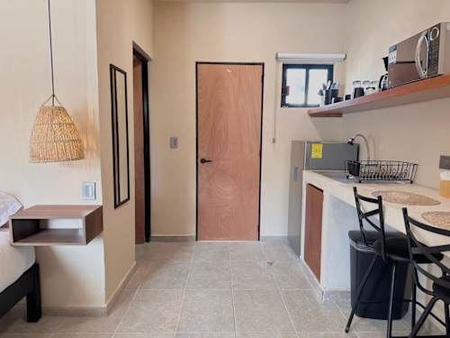 Kitchenette and dining bar at the entrance
