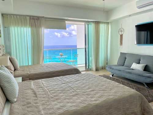 Studio interior with double beds facing the sea