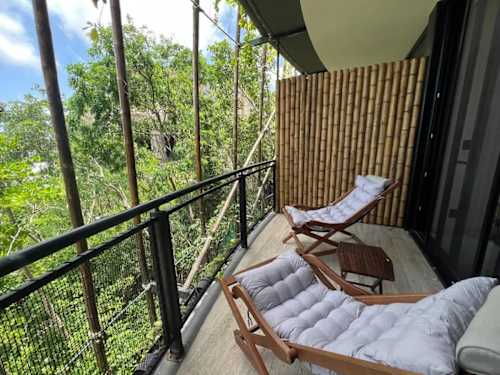 Private terrace with seating overlooking the greenery