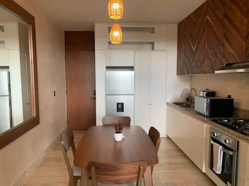 Dining area with stairs to the loft level