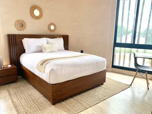 Bedroom with queen bed, ceiling fan, A/C and jungle views