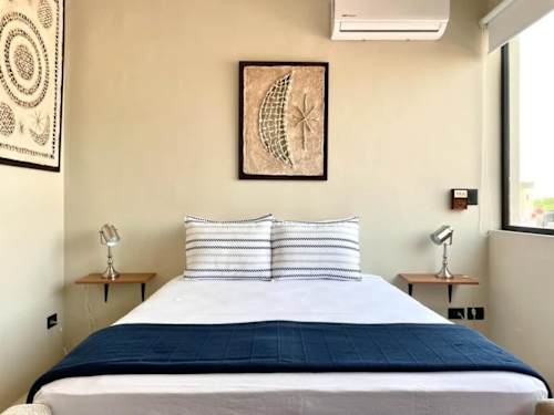 Bedroom with queen-size bed, ceiling fan and A/C