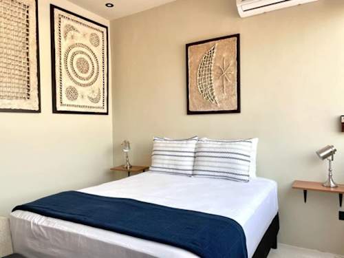 Bedroom with queen-size bed and A/C