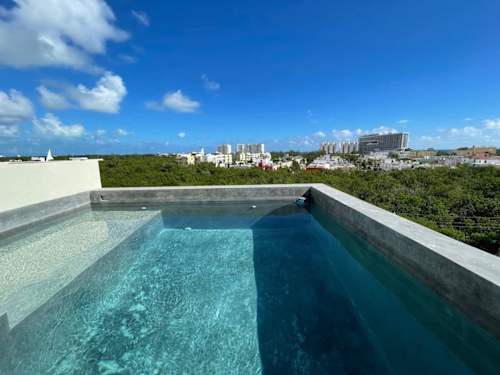 Shared rooftop pool with panoramic views (common area)