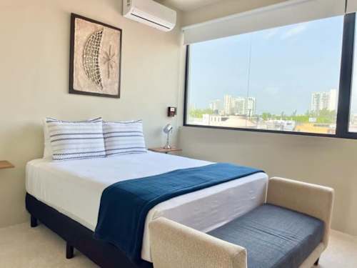 Bedroom with queen-size bed and ceiling fan