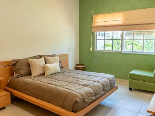 Bedroom with green accent wall