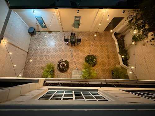 Shared interior courtyard with stone tiles (common area)