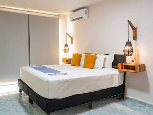 Double bed with A/C and accent pillows
