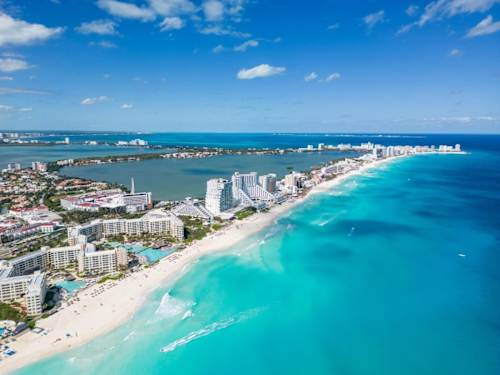 Nearby: Cancun Hotel Zone beach (aerial)