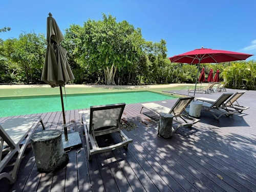 Nearby: beach club with palapa loungers