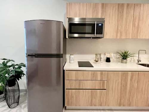 Kitchenette with refrigerator and microwave
