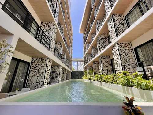 Shared rooftop pool with ocean views
