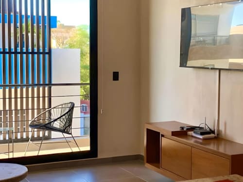 Living room and balcony with city view