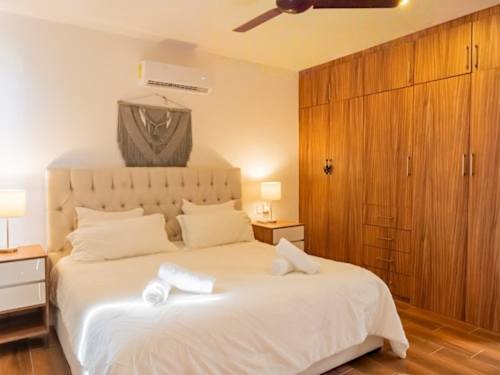 Bedroom 1 - King bed with A/C, ceiling fan, wardrobe and smart TV