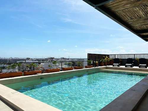 Shared rooftop pool overlooking the sea