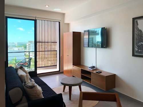 Bedroom workspace with desk and Smart TV