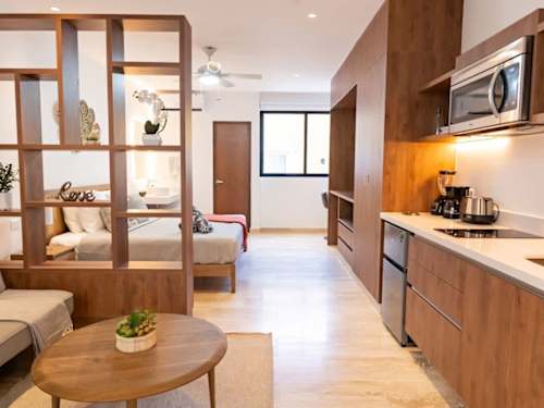 King-size bed and integrated living area with smart TV