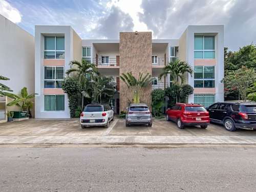 Condominium building exterior with parking