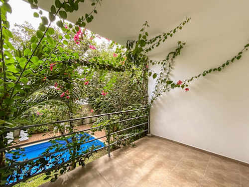 Living room with sofa and balcony access