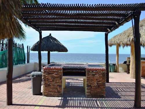 Direct beach access with palapas and ocean views