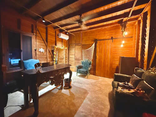Bedroom with two beds and warm wood interior