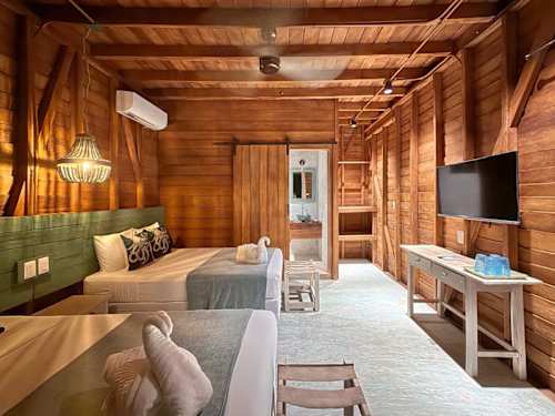 Cozy wood room with two beds