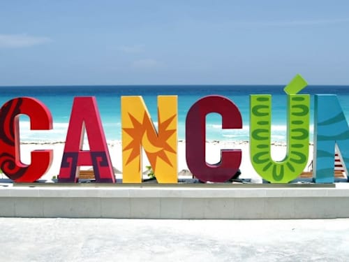Nearby: iconic Cancun sign and downtown attractions.