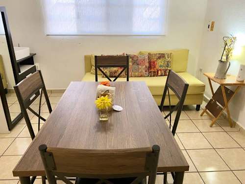 Round dining table in the open living space