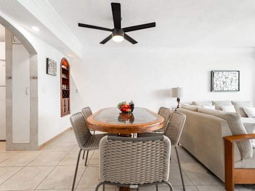 Living and dining area with ceiling fan