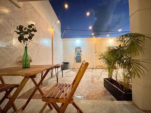 Terrace table and chairs with plants (shared area)