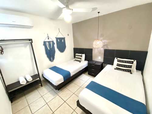 Two single beds with bright bedding