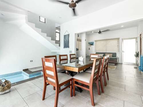 Dining area seating 8 with ceiling fan