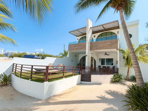 Private villa terrace with plunge pool framed by tropical palms