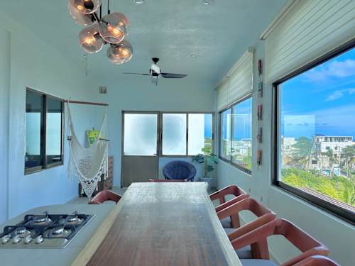 Open living and dining area with sea views