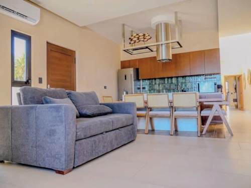 Living room with sofa bed and dining area