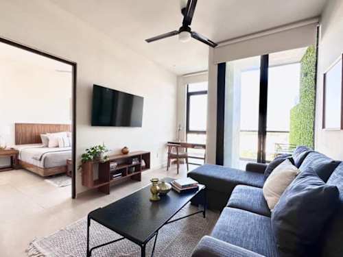 Living and dining area with balcony access