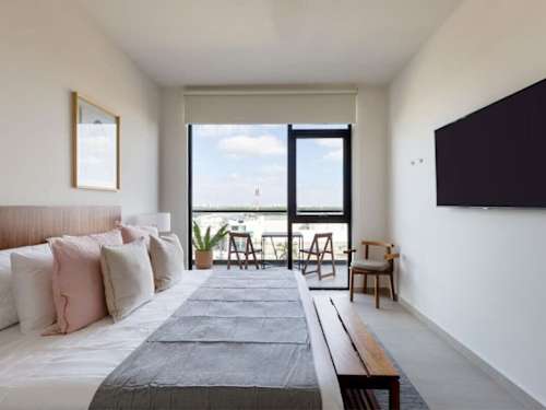 Living room with Smart TV and lagoon views