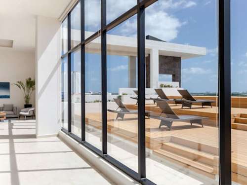 Floor-to-ceiling windows with open views