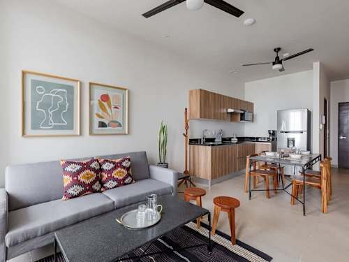 Living room with open dining area and kitchen