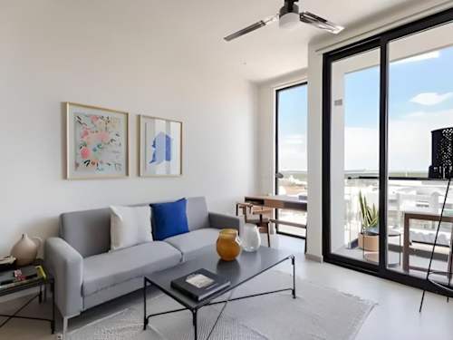 Living room with sofa and Nichupte Lagoon views